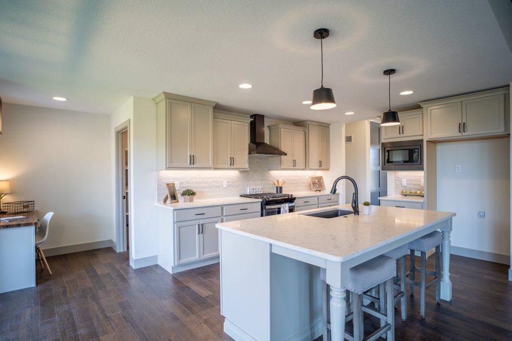 Open Kitchen With Study Desk by Hansman Custom Homes in Mid-Missouri