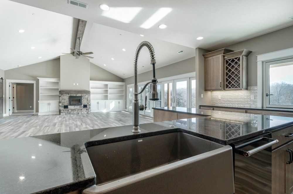 Custom Sink in Front of Spacious Living Room by Hansman Custom Homes in Mid-MO