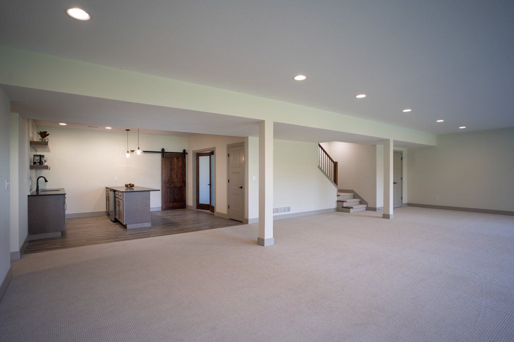 Downstairs Kitchen & Basement by Hansman Custom Homes in Mid-MO