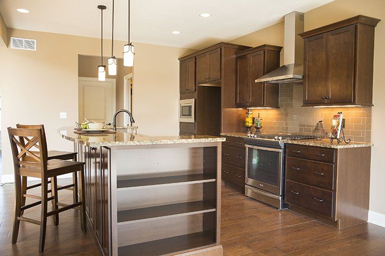 Kitchen Island With Chairs & Shelves Made by Hansman Custom Homes in Mid-Missouri
