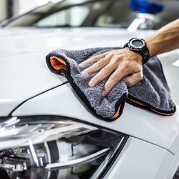 person cleaning car