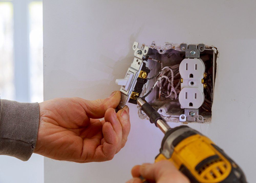 Electrician Installing a Power Switch — Vineland, NJ — Wells Electric