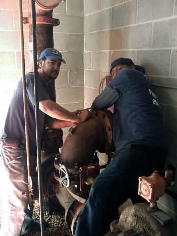 Wells Electric Workers Working on Pipe — Vineland, NJ — Wells Electric