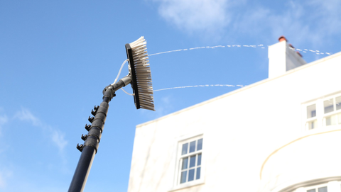 Window cleaner with spray