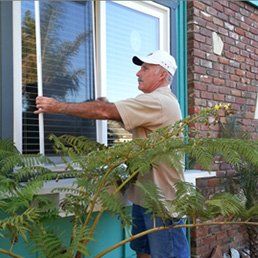 Man Installing A Window — Window Screens in Goleta, CA