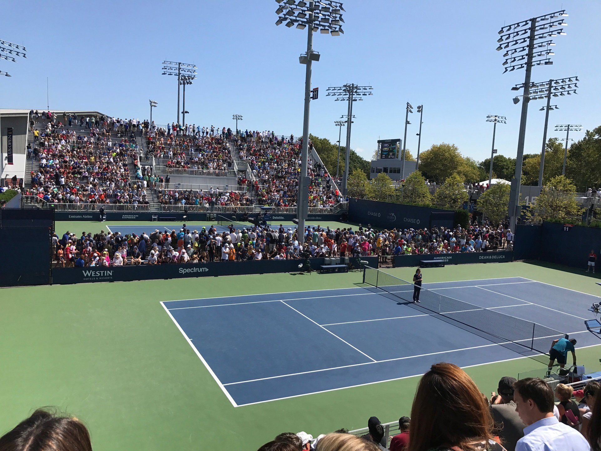 Resurfaced Tennis Court and Large Crowd at Major Tournament