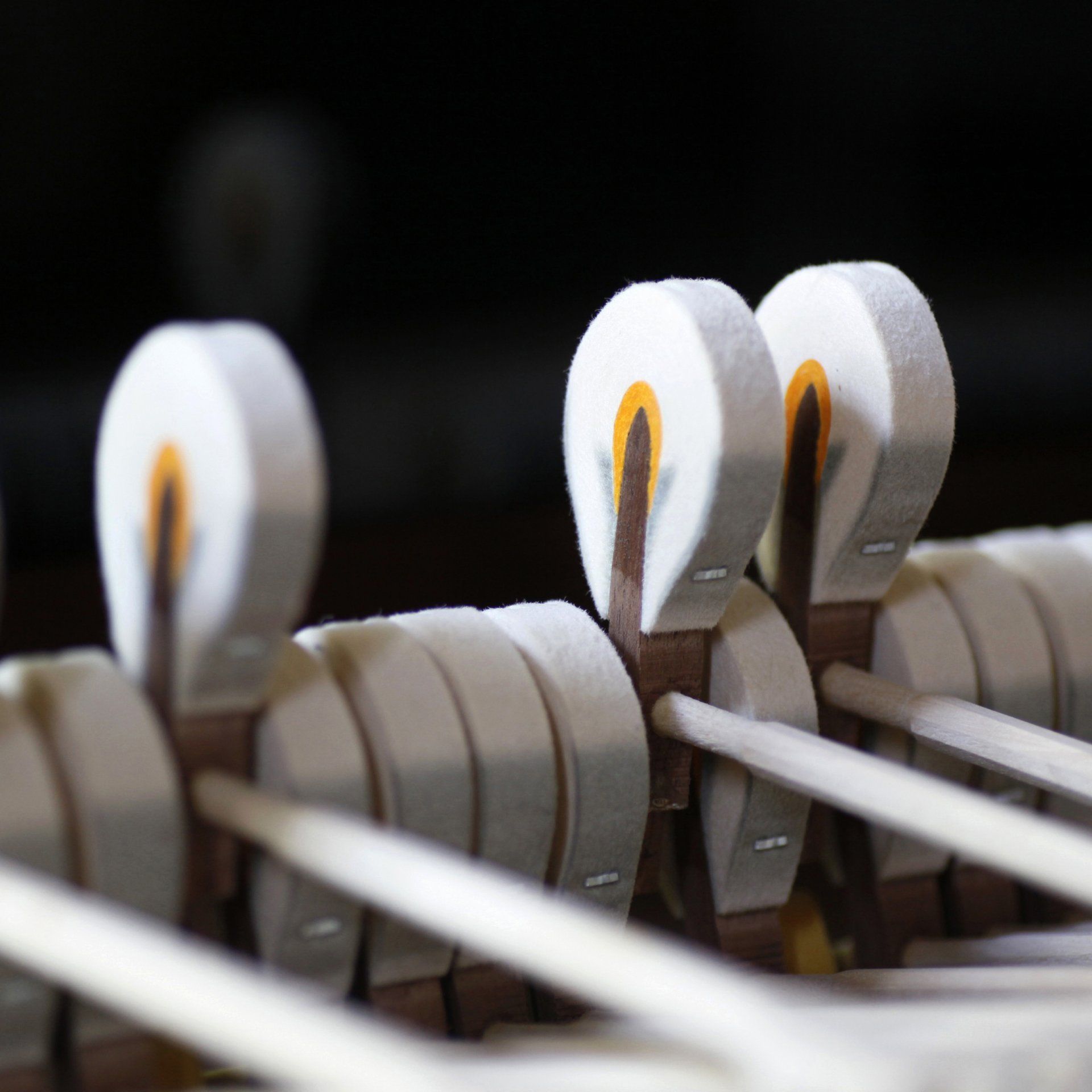 a close up of a piano keys with a black background