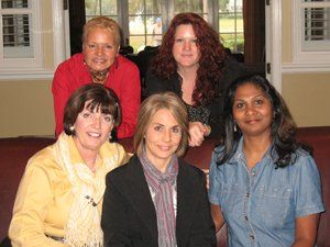 A group of women are posing for a picture together