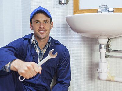 r and d coleman plumber sitting near the sink