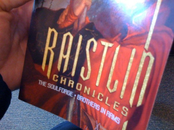 a person is holding a book called baistland chronicles