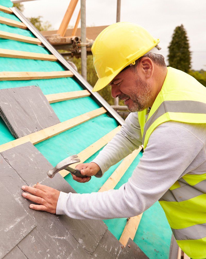 Man Fixing Roof — Dallas, TX — Hard Roofing