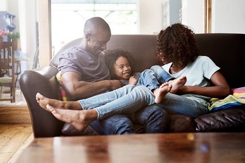 happy family sitting on couch
