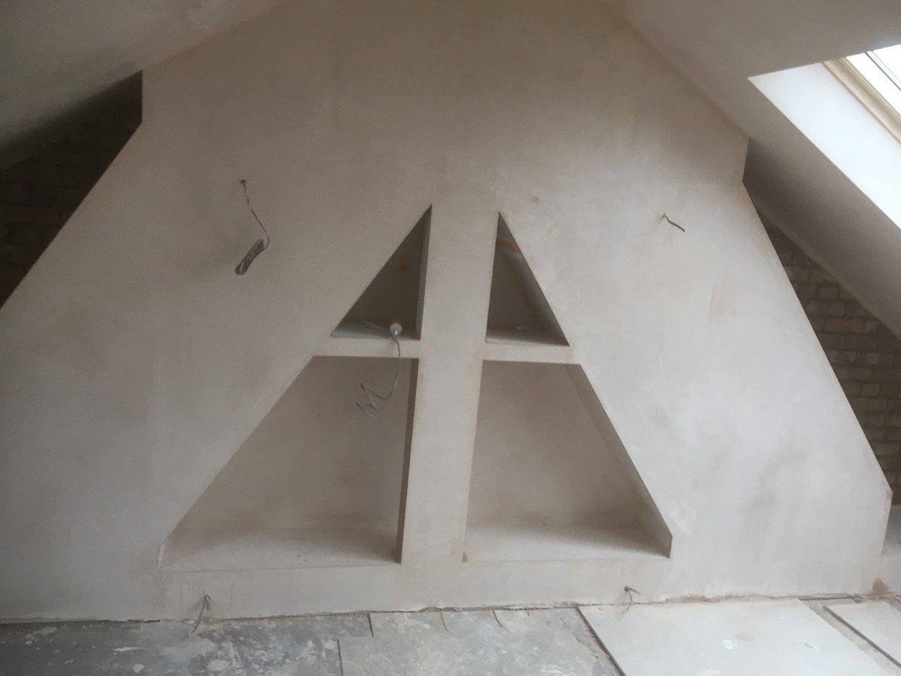 A white wall with a triangle cut out of it