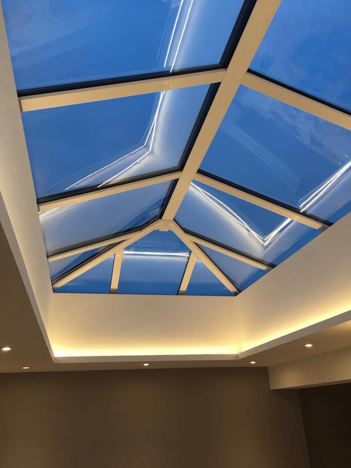 There is a skylight in the ceiling of a room.