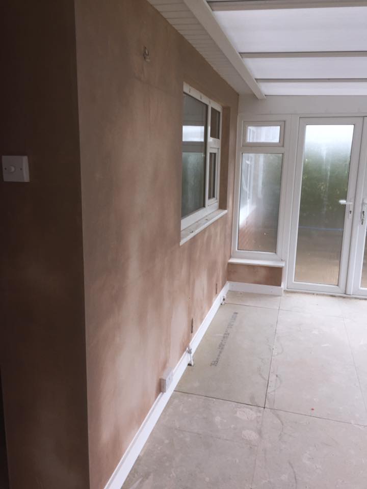 A room with a window and a door in it.