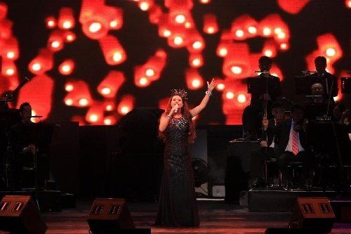 singer in a black dress