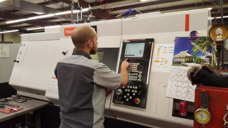 Man Entering Configuration Details into Machine