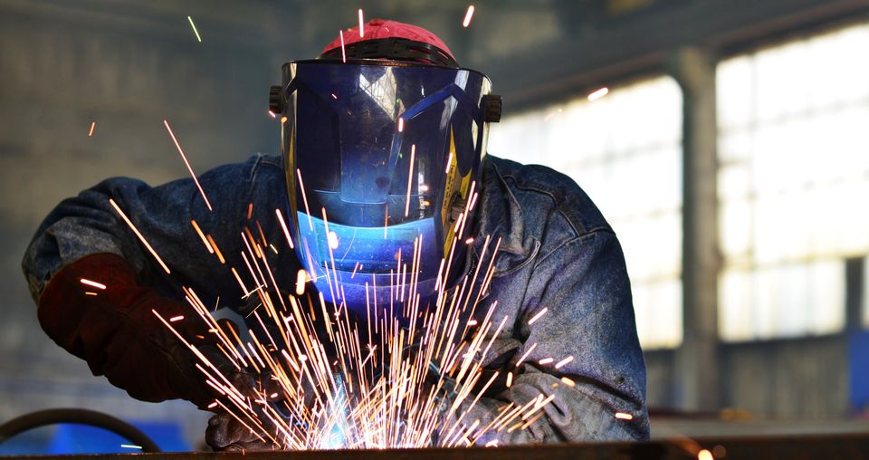 a mechanic processing by CNC milling machine.