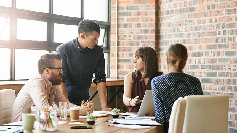 people talking around a table