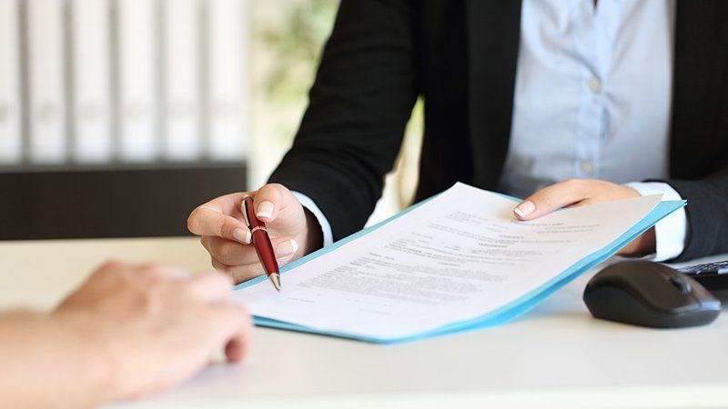 people looking over contract