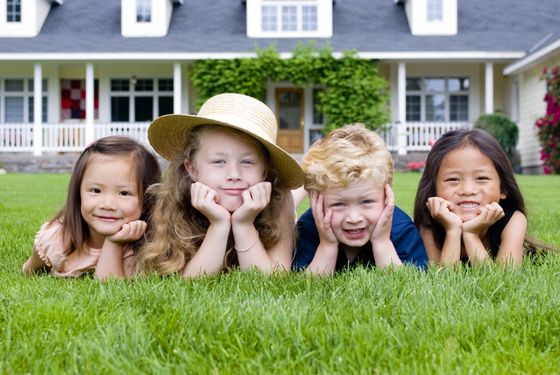 Children Laying in Front Lawn — Mansfield, TX — Organic Pest Services Children Laying in Front Lawn — Mansfield, TX — Organic Pest Services
