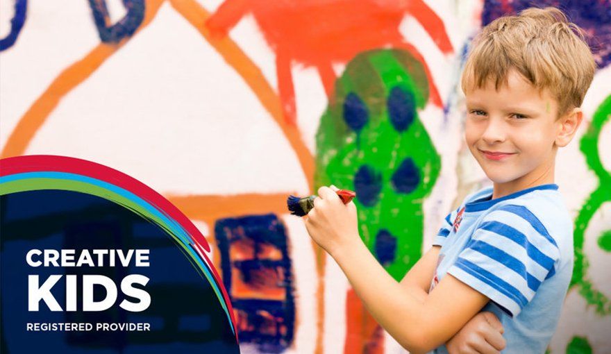 boy with paint brush