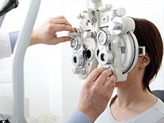 Glaucoma — Woman Using Phoropter in St. Helena, CA