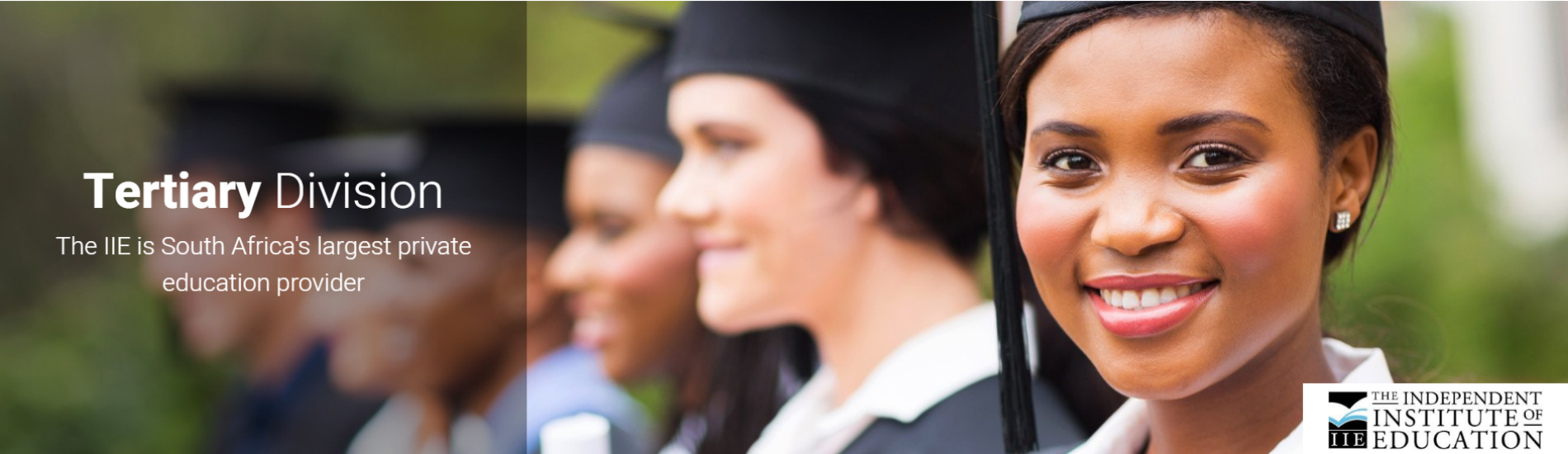 A woman in a graduation cap and gown is smiling