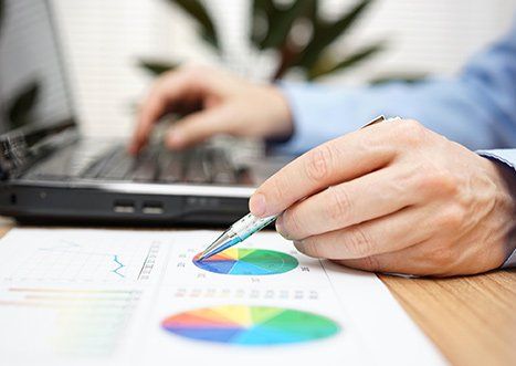 Tax Services — Man Checking Tax Chart in Indianapolis, IN