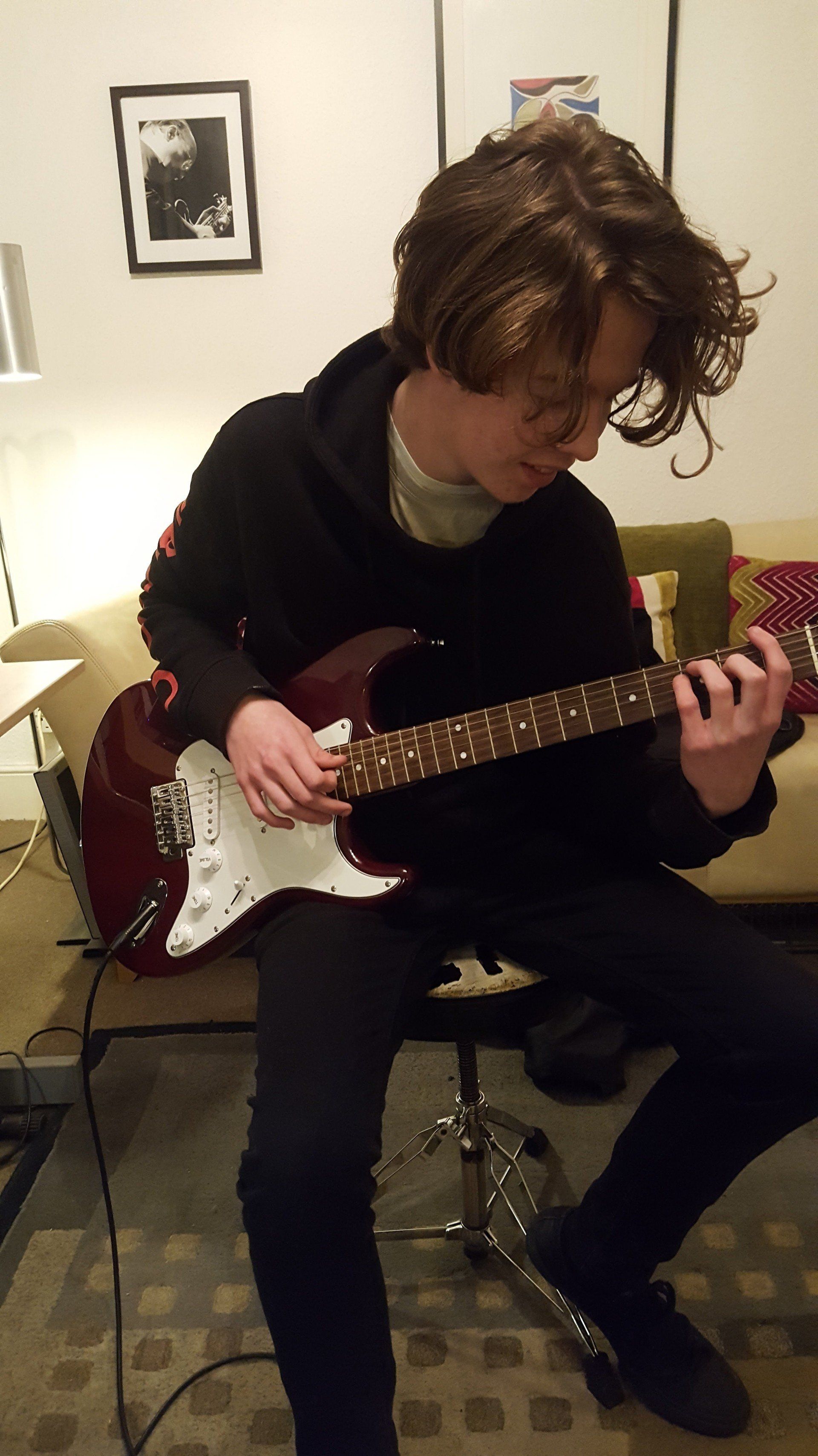 A guitar student taking a lesson