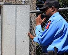 Security Guard Communicating Using A Handheld Transceiver — Elk Grove, CA — Airborne Security Patrol, Inc. Security Guard Communicating Using A Handheld Transceiver — Elk Grove, CA — Airborne Security Patrol, Inc.