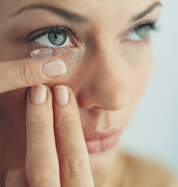 Woman Putting on Her Contact Lens — Clearwater, FL — David B. Brill, O.D., P.A.
