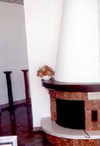 Fireplace in polished Botticino marble