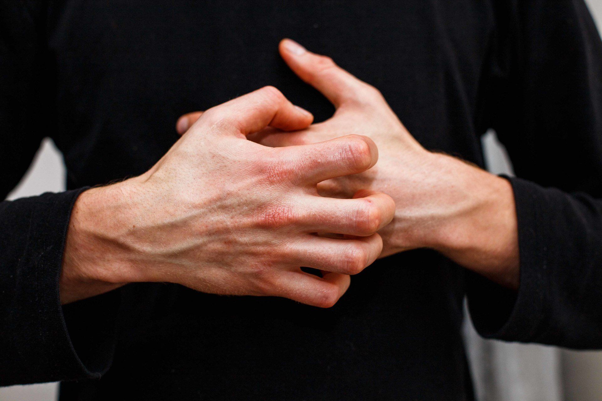 person itching their hands