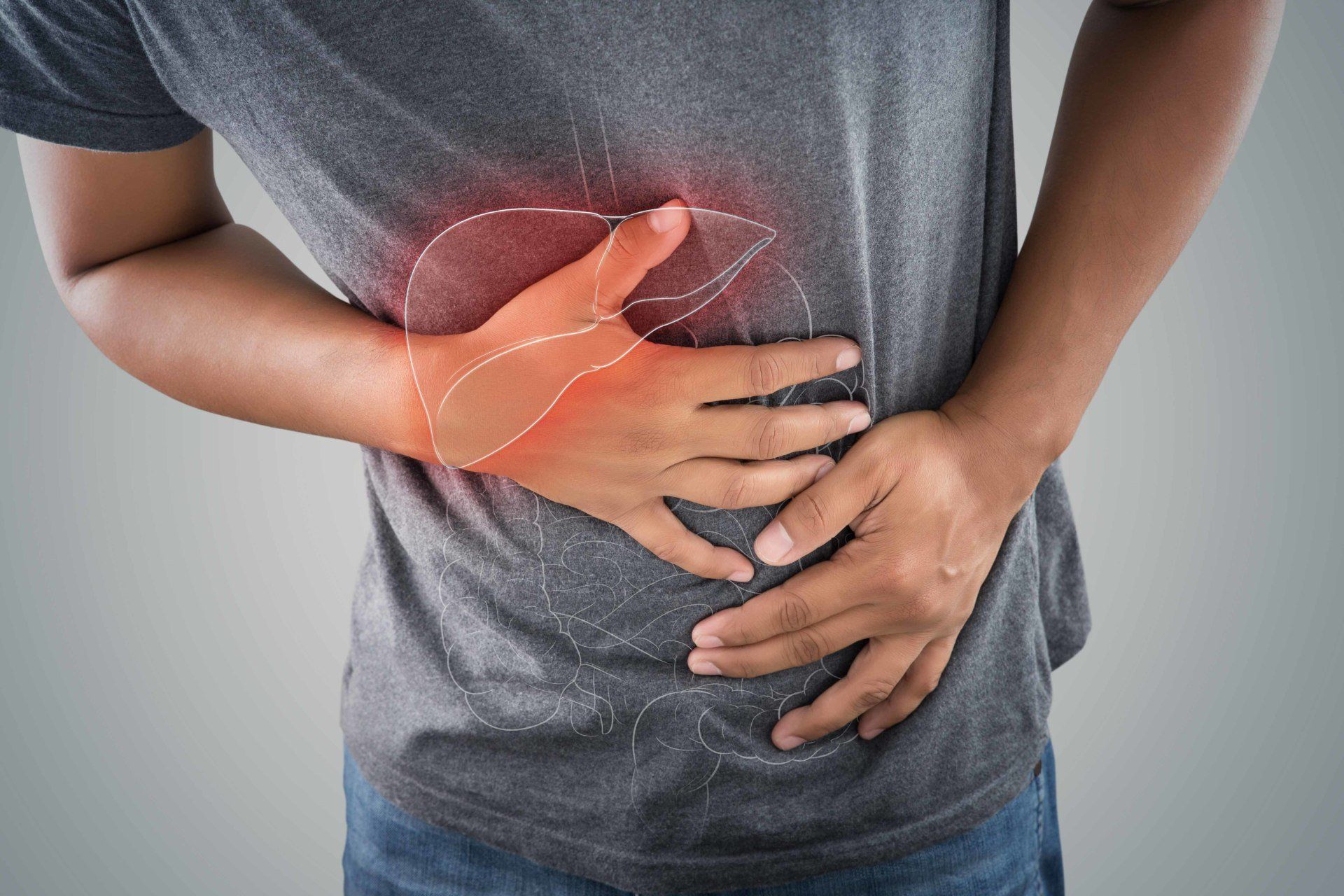 man clutching stomach with celiac disease