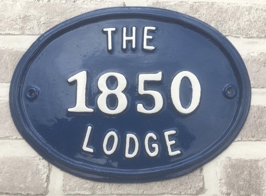 Blue The Lodge house sign