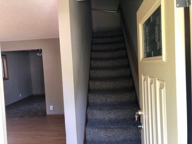 A staircase leading up to the second floor of a house