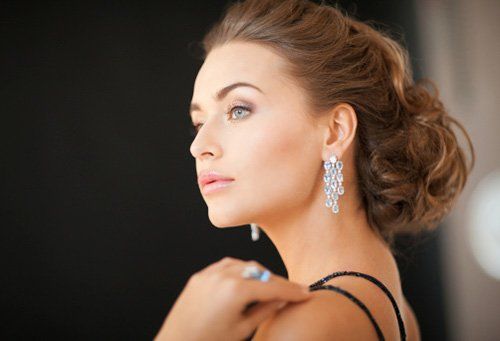 Woman with diamond earrings - Jewelry Services in Saratosa, FL Woman with diamond earrings - Jewelry Services in Saratosa, FL