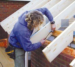 Man fitting loft roof