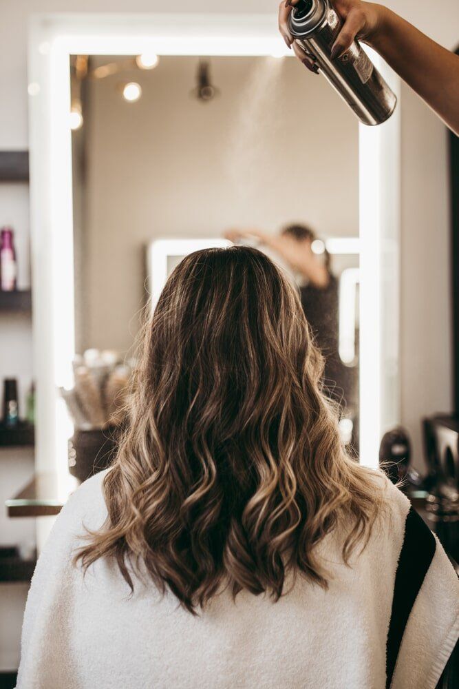 Woman with Curly Hair — Hair Salon in Townsville, QLD