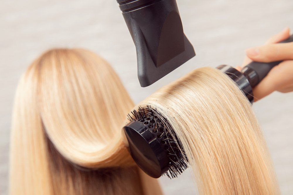 Woman with Blonde Hair — Hair Salon in Townsville, QLD