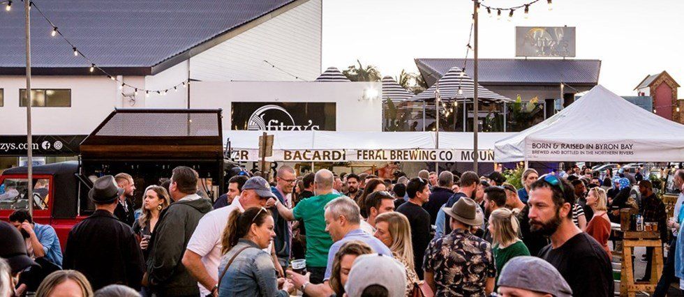 A large group of people are standing in front of a building.