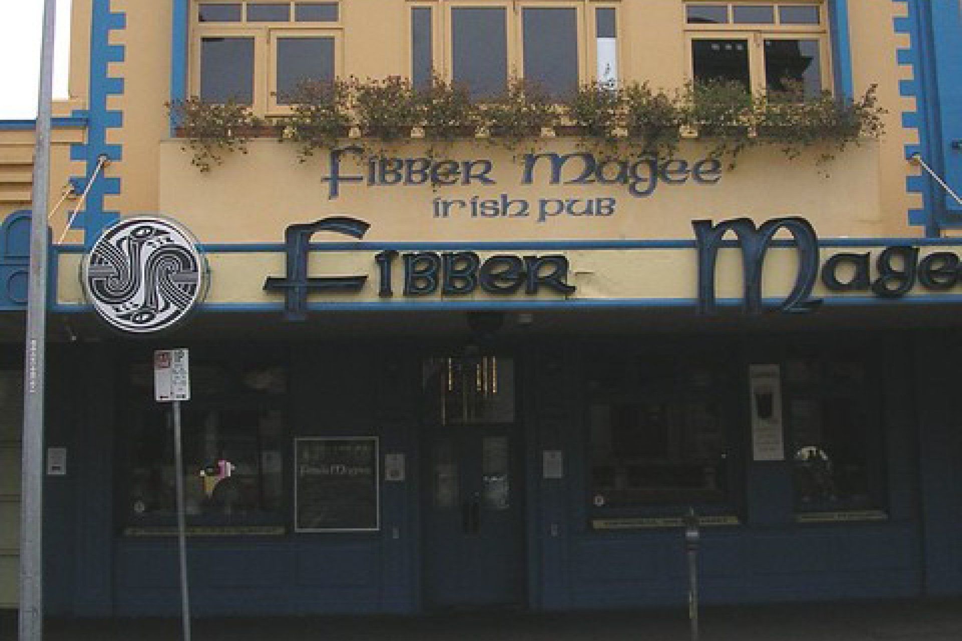 The fibber magee irish pub has a blue and yellow facade