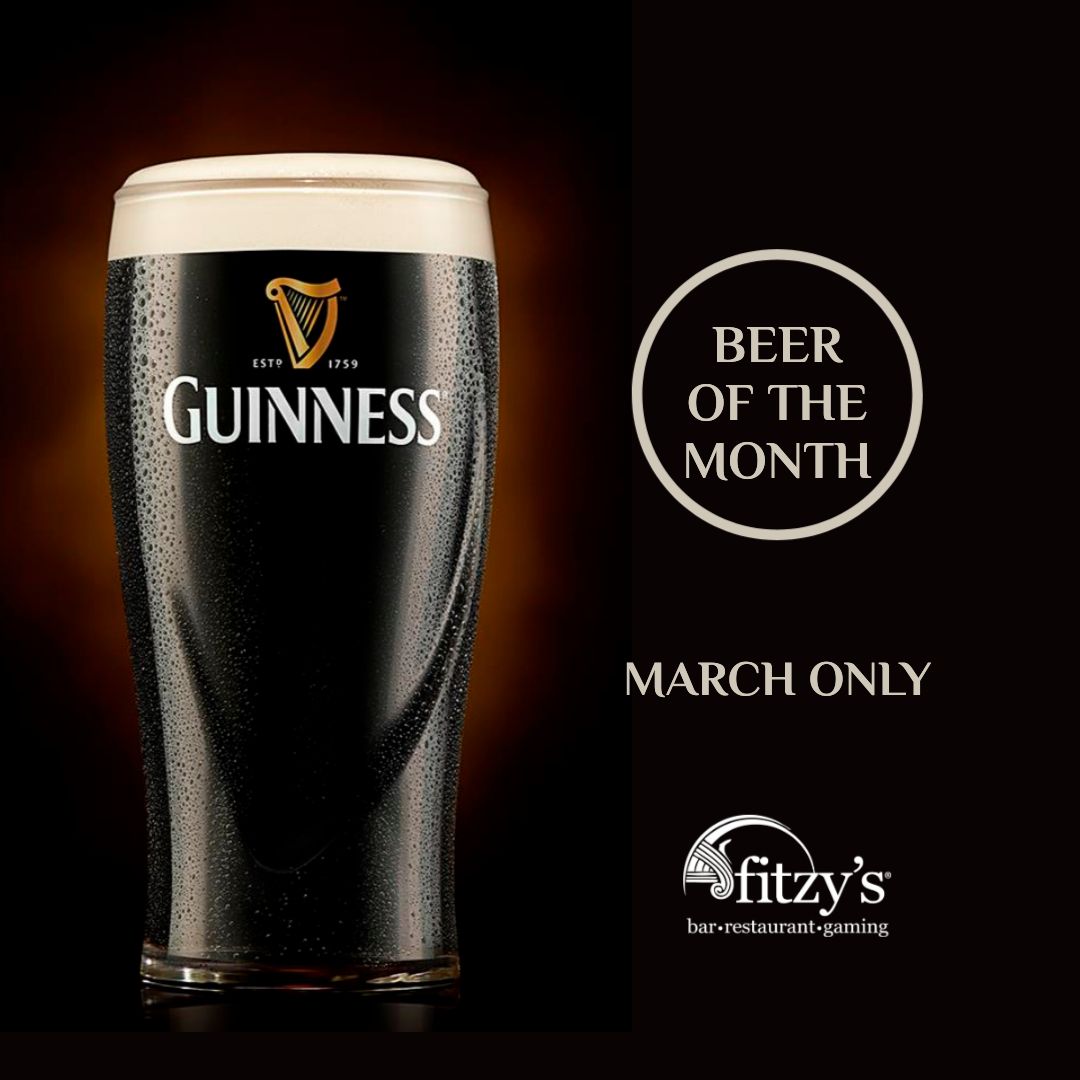 A glass of guinness beer on a black background