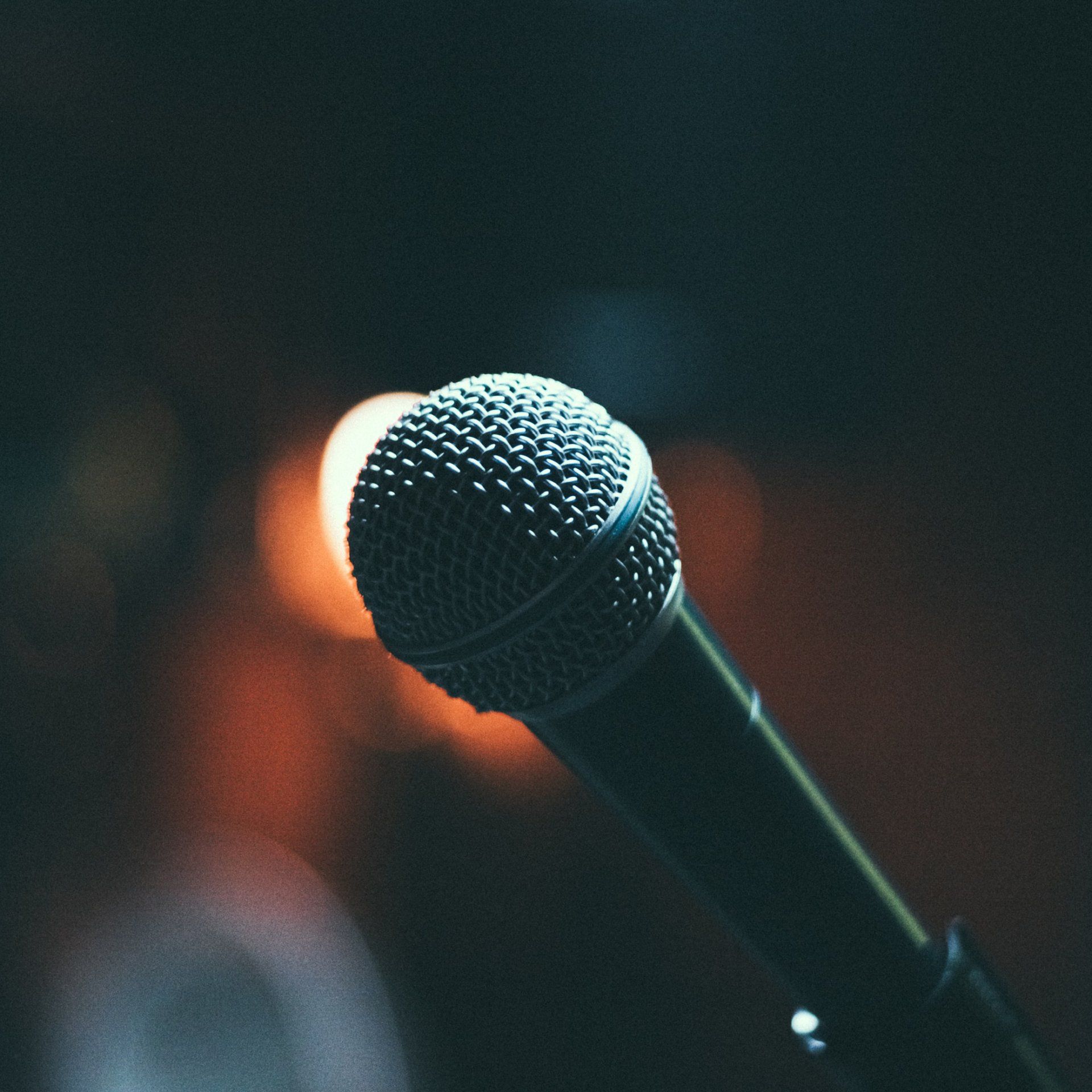 A close up of a microphone in a dark room
