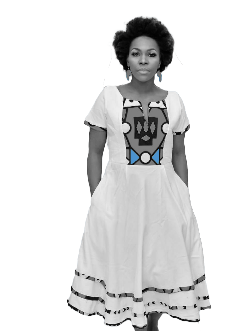 A black and white photo of a woman in a white dress