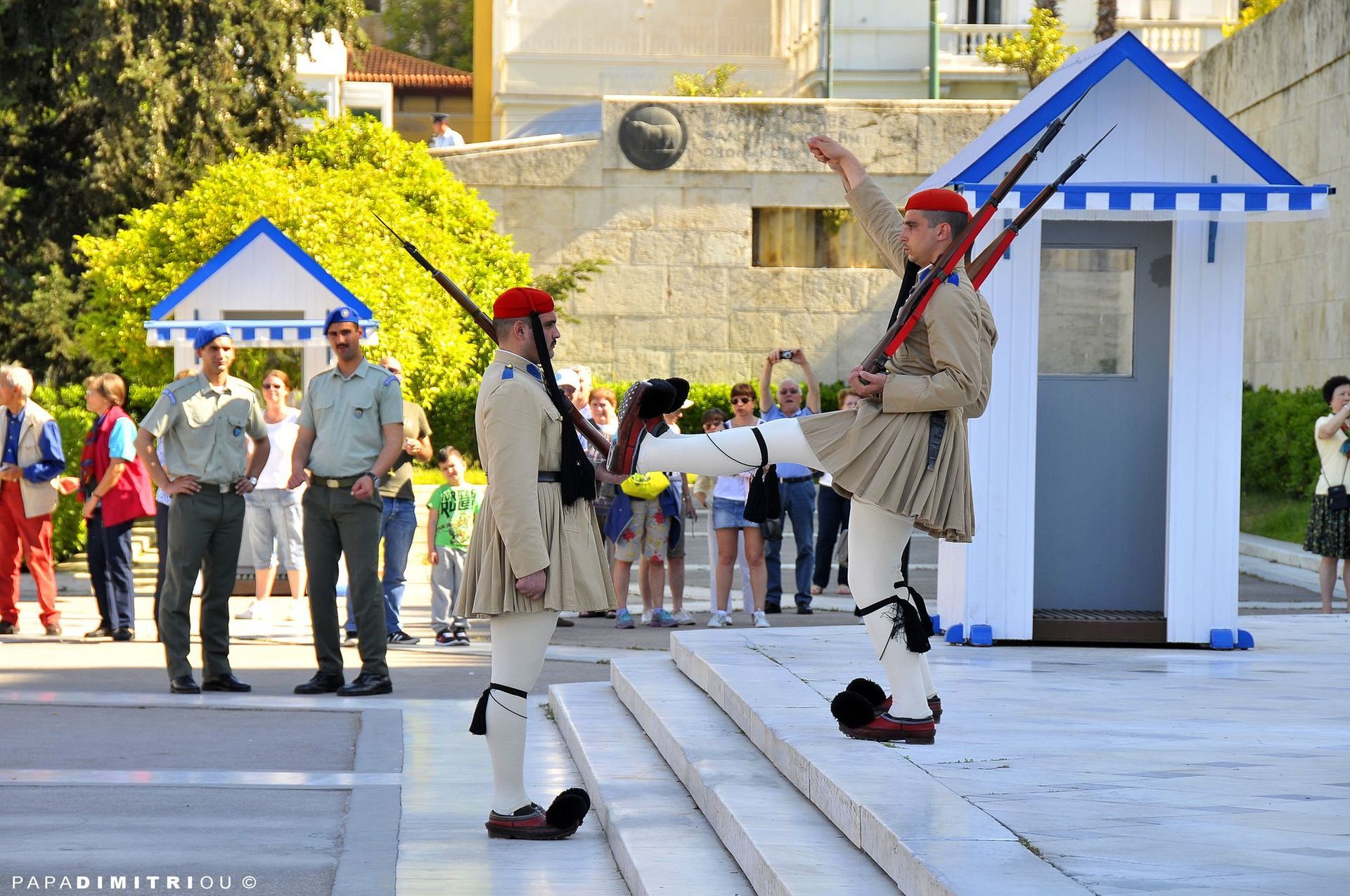 A guide leading a group of tourists at Syntagma in Athens.