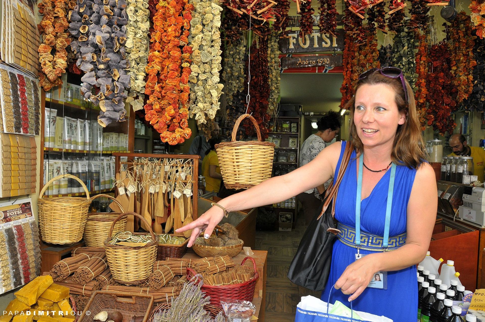 A guide leading a group of tourists at the Food tour in Athens.