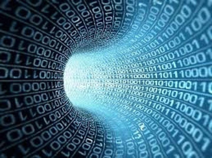 A tunnel of binary code with a light coming out of the end.