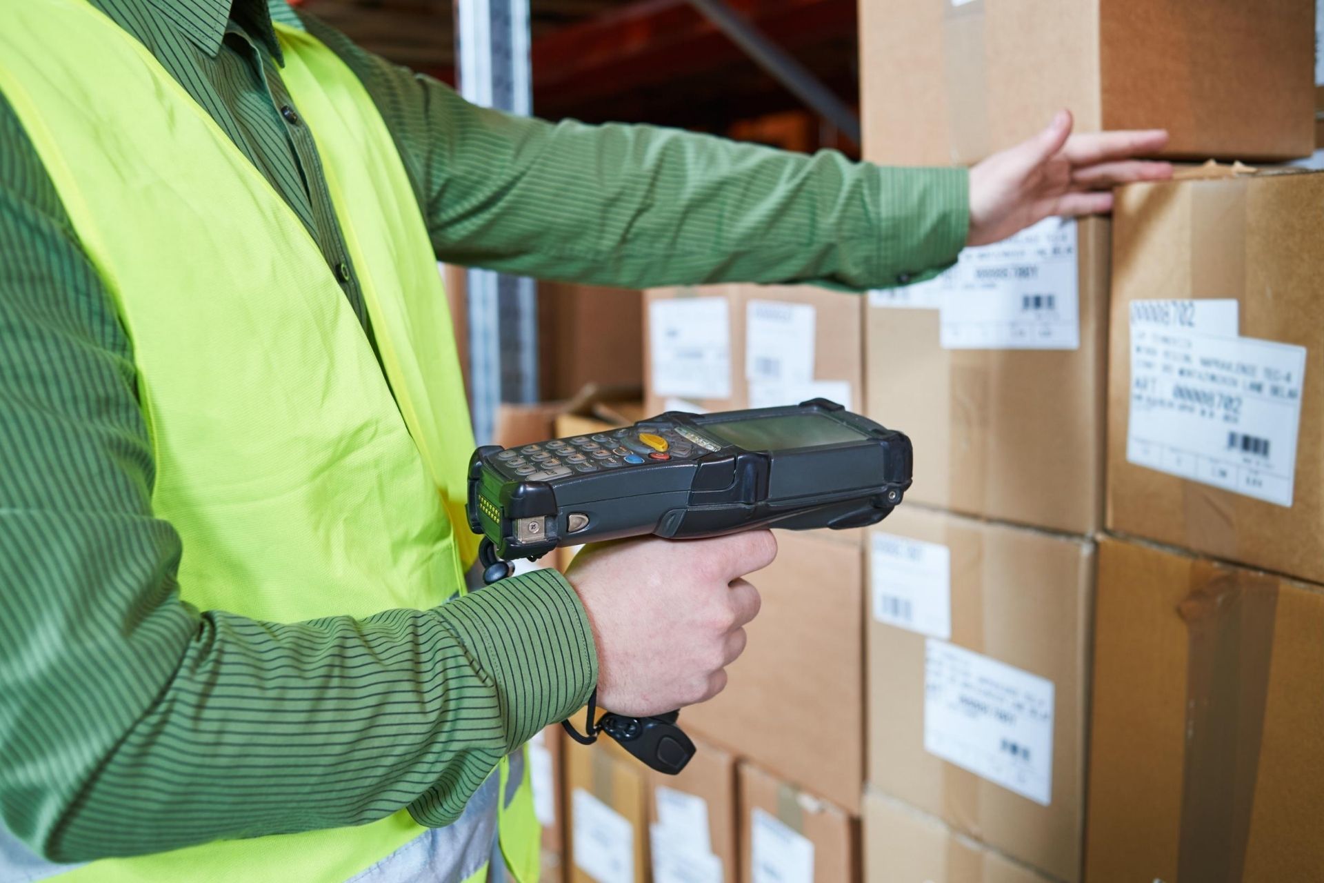 Man scanning boxes